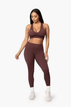 Load image into Gallery viewer, Burgundy &quot;V&quot; shaped sports bra. DH logo on left side.
