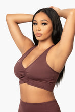 Load image into Gallery viewer, Burgundy &quot;V&quot; shaped sports bra. DH logo on left side.

