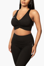 Load image into Gallery viewer, Black &quot;V&quot; shape sports bra. DH logo on right side.
